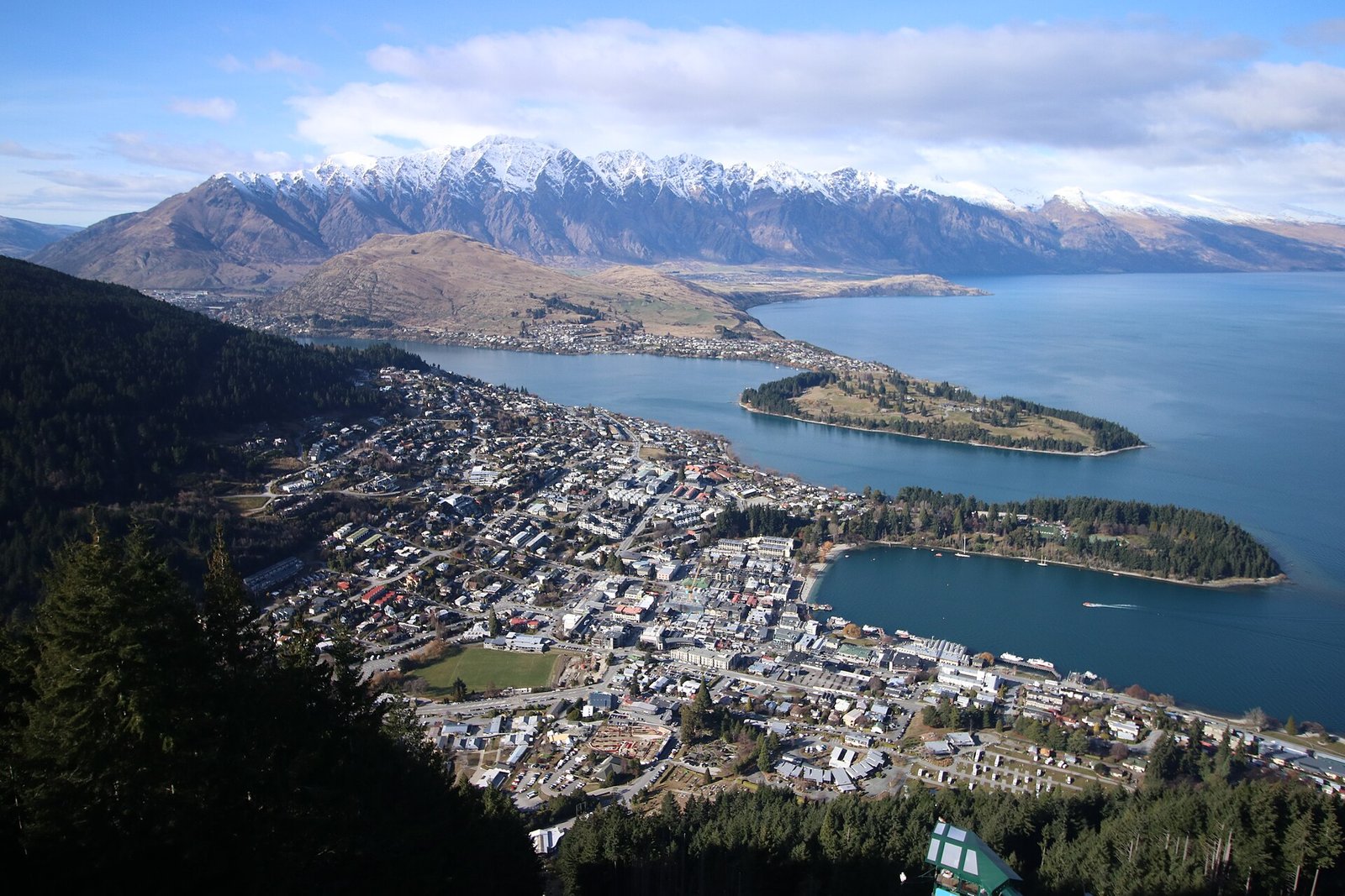 View of downtown Queenstown, New Zealand, surrounded by mountains and Lake Wakatipu