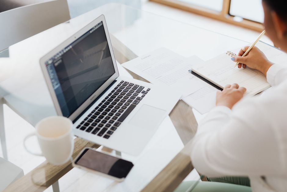 Person researching and comparing travel deals on a laptop