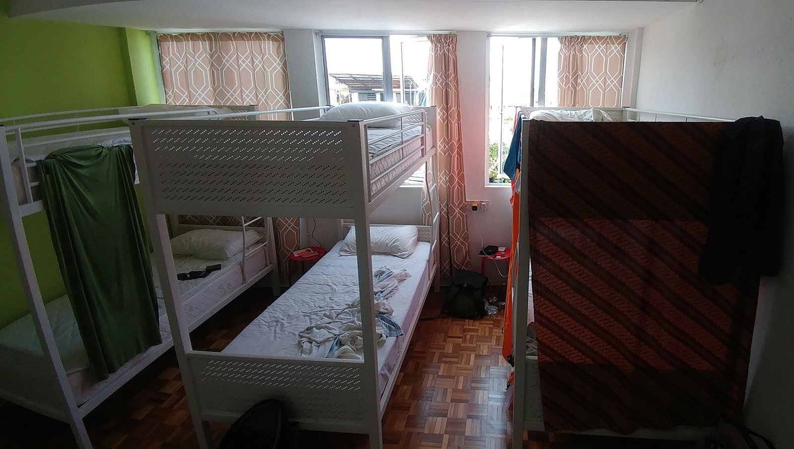 A shared hostel dormitory room with bunk beds for travelers