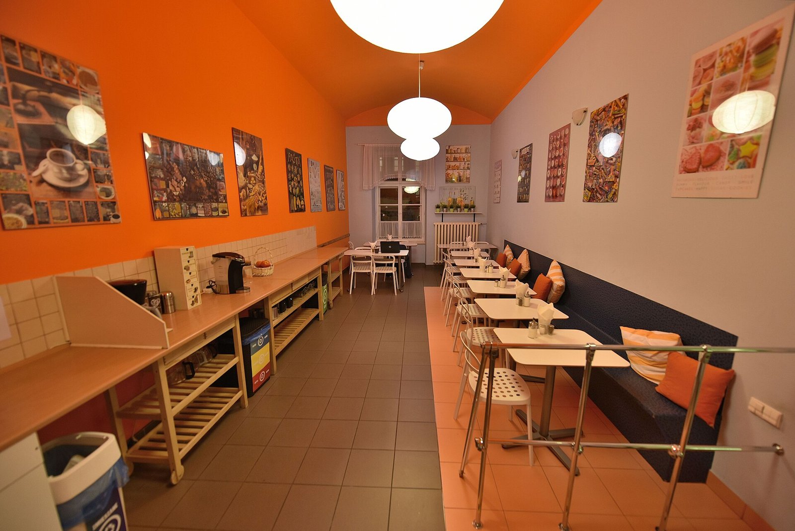A shared kitchen and common space inside a hostel