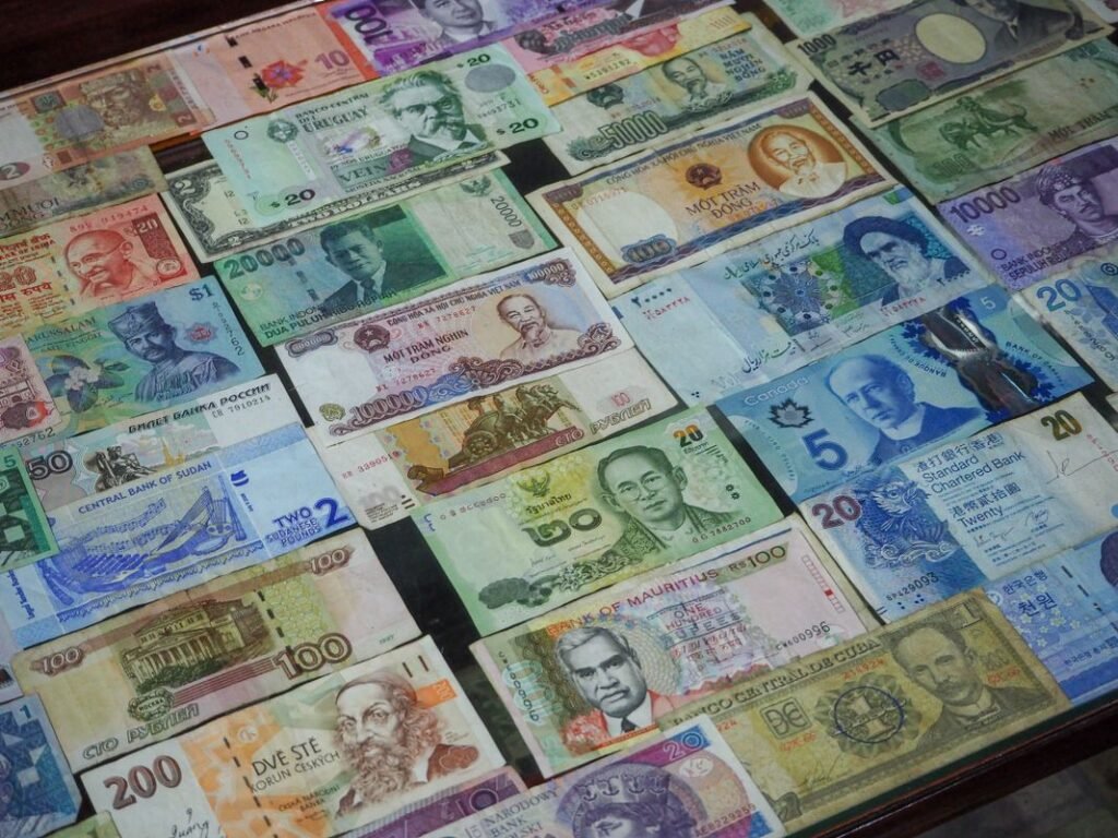 Colorful banknotes from different countries, since tipping customs and currency both change by destination