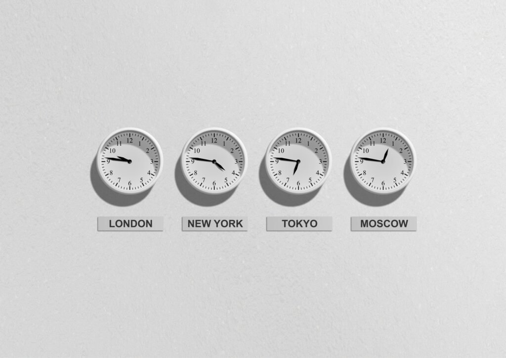 Wall clocks showing different time zones, the kind of time difference this Jet Lag Calculator helps you plan for