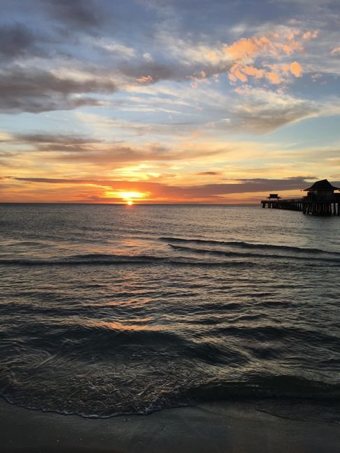 Sunset over the Gulf of Mexico at Naples Pier, Florida