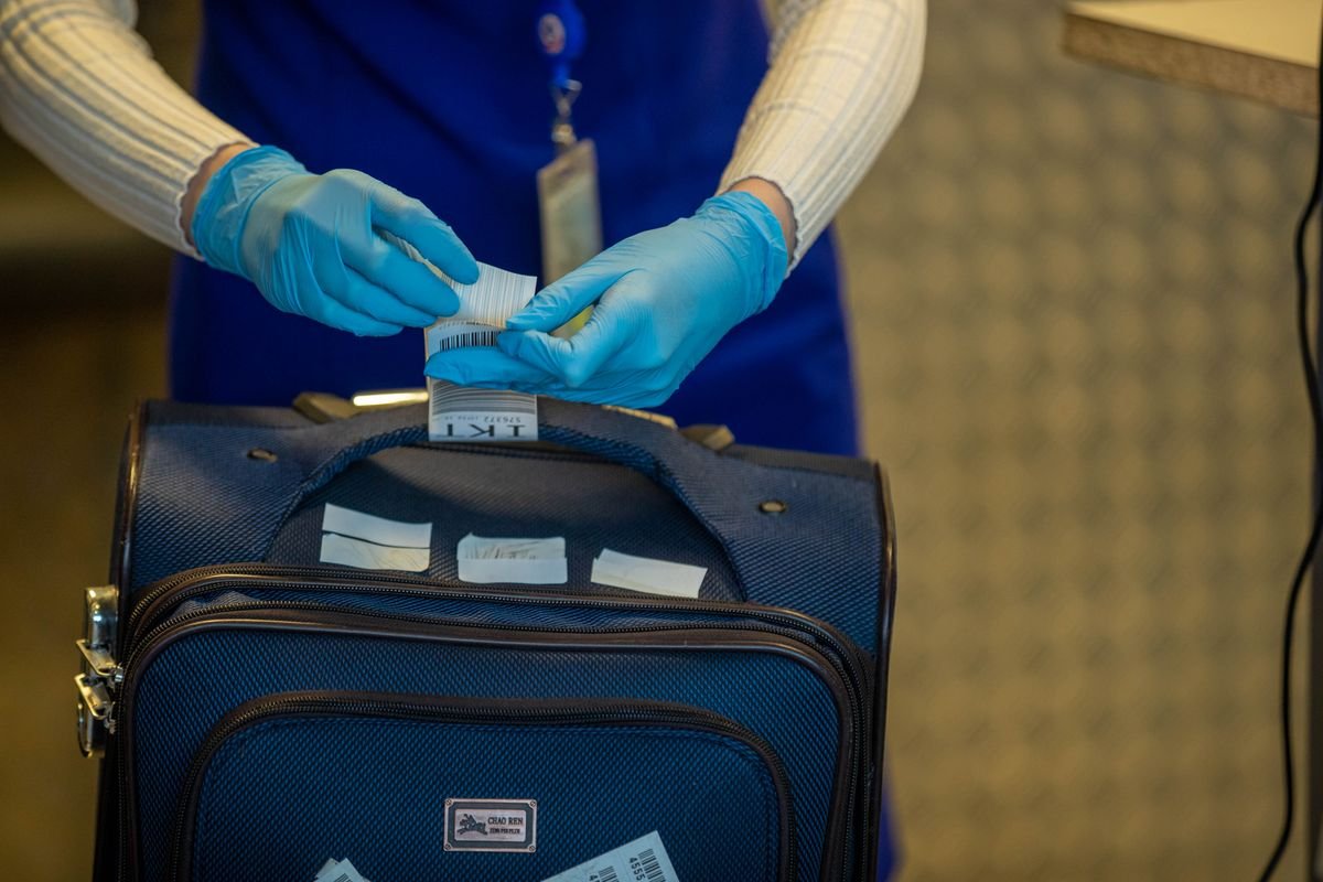 Airport security checkpoint with luggage inspection