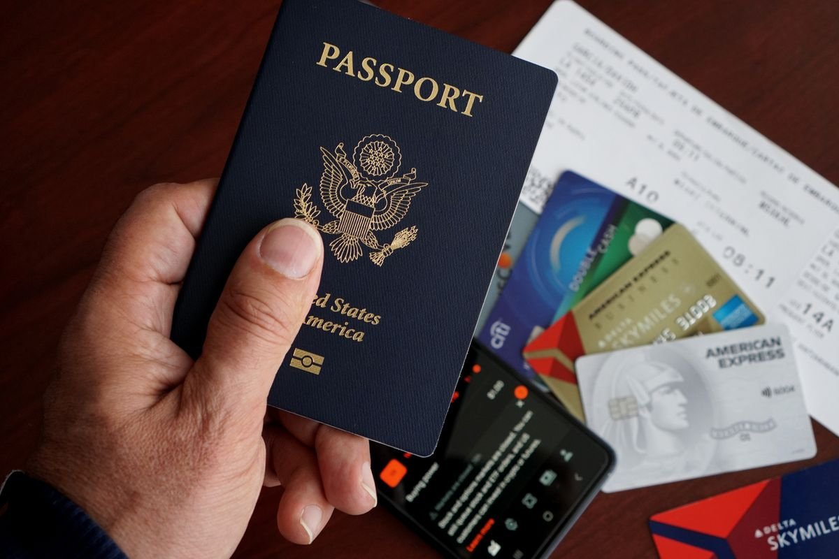 US passport displayed with travel essentials