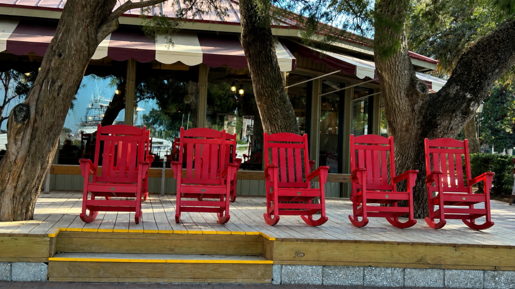 Red rocking chairs at a Hilton Head waterfront restaurant